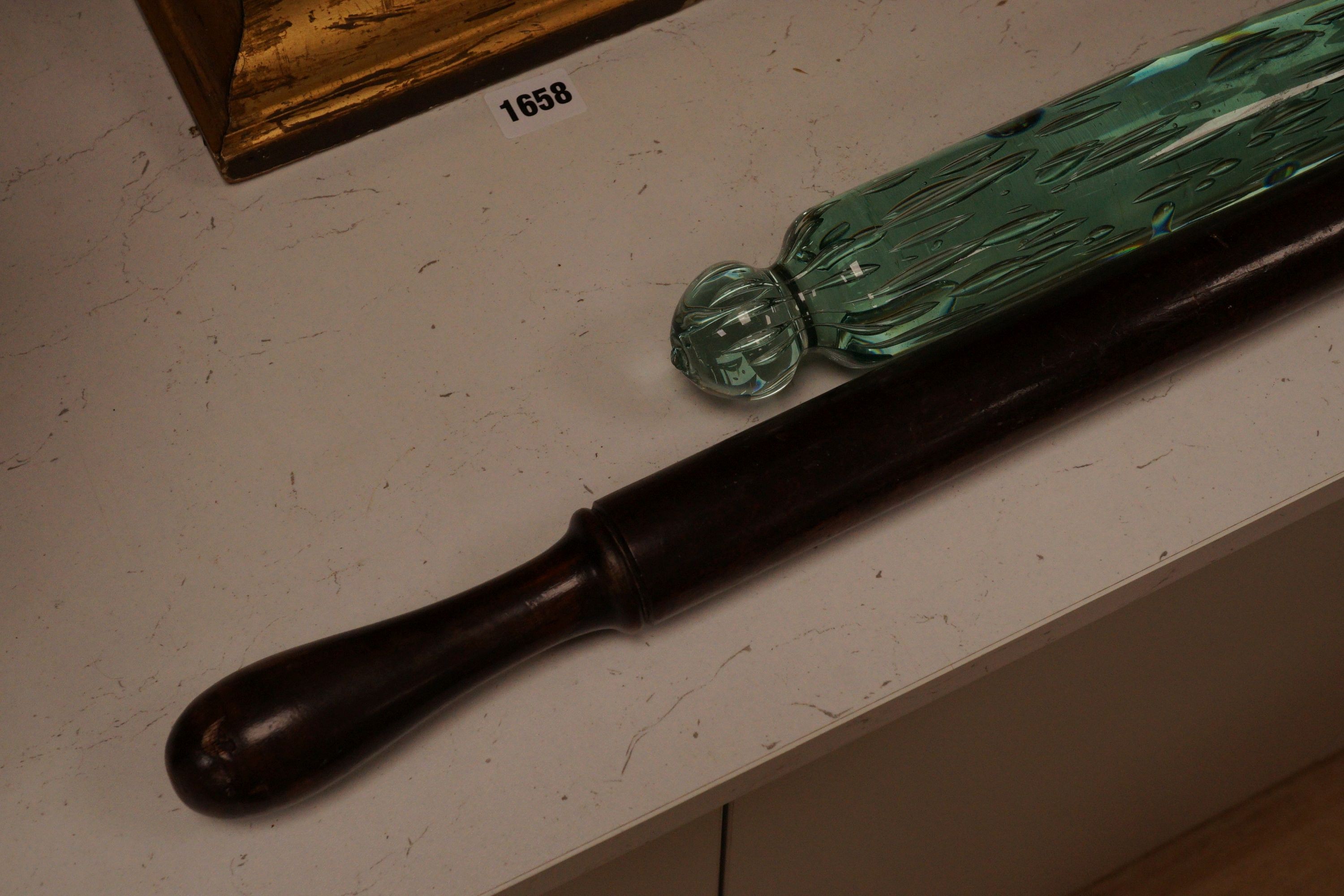 A Victorian glass rolling pin together with a turned wooden example, widest 82cm (2)